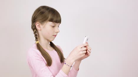 conceptual-emotions,-teen-girl-communicates-with-friends-on-social-networks,-portrait-on-light-background