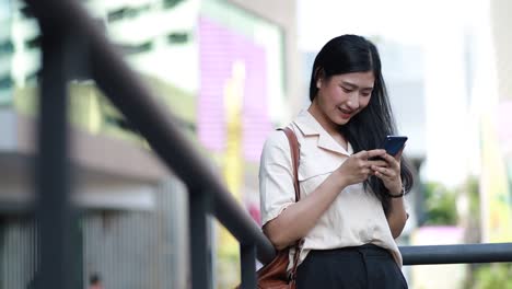 Asian-woman-using-mobile-phone