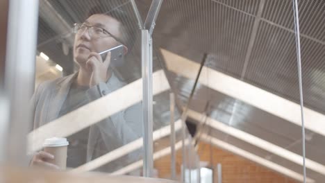 Businessman-Having-Telephone-Conversation