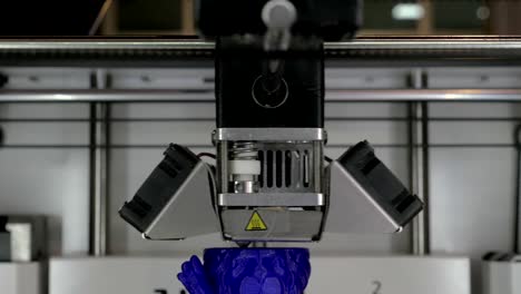 Close-up-view-of-printing-plastic-model-on-a-3D-printer-in-process