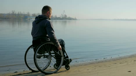 Disabled-man-in-wheelchair-near-river.---Faith-in-future