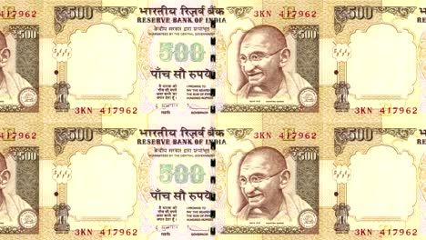 Banknotes-of-five-hundred-indian-rupees-of-India-rolling,-cash-money,-loop