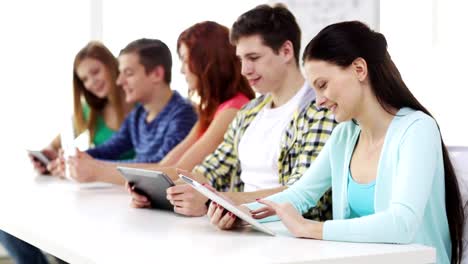 happy-students-with-tablet-pc-computers-learning-at-school