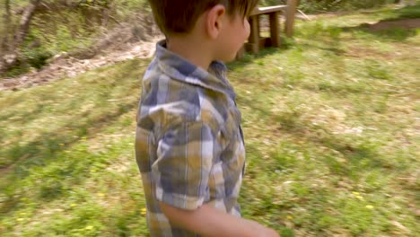 Happy-excited-young-4---5-year-old-boy-holding-a-basket-filled-with-easter-eggs