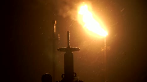 Oil,-gas-torch-at-night-in-the-taiga.