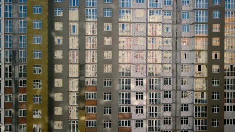 Aerial-view.-Urban-area-in-the-metropolis.-Construction-of-high-rise-residential-apartments-in-the-city.-Sale-and-rental-of-residential-real-estate.-Facade-of-the-house