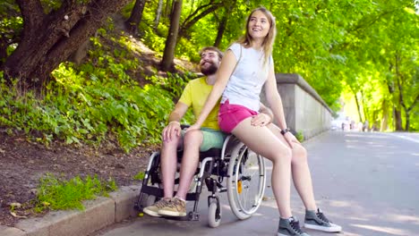 Young-disable-man-on-a-walk-in-the-park-with-his-wife