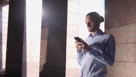 Man-With-Phone.-Businessman-Using-Smartphone-Outdoors