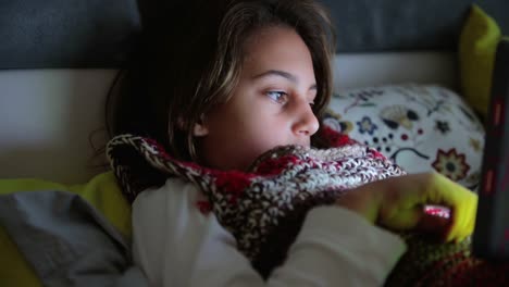 Little-girl-studying-and-doing-homework-at-home-with-tablet.