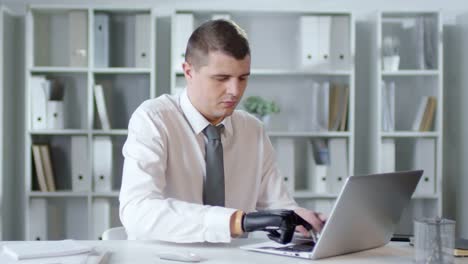 Multiple-Footages-of-Businessman-with-Prosthetic-Arm-Working-in-Office