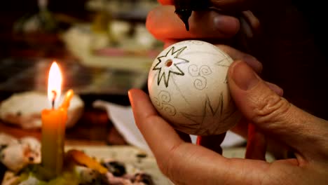 female-craftman-hands-painting-easter-egg-traditonal-folk-process-creating-layer-by-layer-with-the-wax-and-using-multicolored-paints-close-up