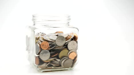 save-money-for-investment-concept-thai-coins-in-a-glass-jar