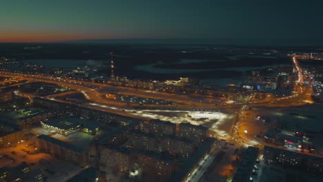 Night-city-with-bright-lights-of-lanterns-and-garlands.-Town-removed-from-drone.