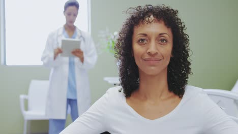 Close-up-of-African-american-disabled-female-patient-sitting-on-wheelchair-in-the-ward-at-hospital