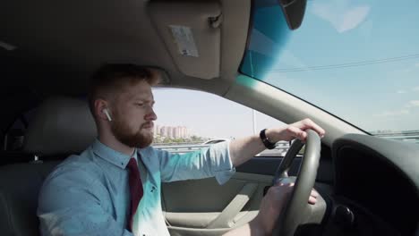 Concentrated-busy-business-man-driving-his-car-to-work-in-urban-city