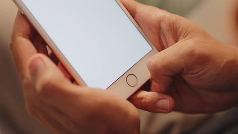 African-american-male-hand-pressing-a-button-on-a-smartphone