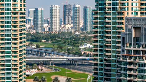 Golf-field-timelapse-from-top-at-day-time-with-traffic-on-sheikh-zayed-road