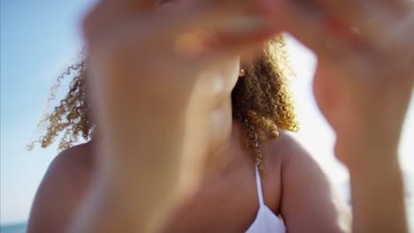 Plus-size-Ethnic-female-taking-selfie-at-sunset