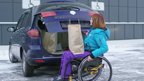 Disabled-Female-Driver-Loading-Shopping-Bags-in-Car