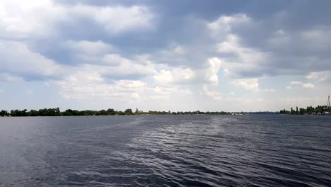 The-river-port-accepts-and-ships-the-cargo-across-the-water.-Mysterious-clouds-are-flying-very-low-over-river.