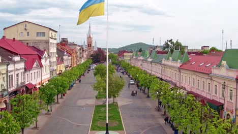 Aerial-view-Peace-Square-of-Mukachevo.-Nearby-is-the-Gothic-chapel-of-St.-Joseph,-city-hall-і-Cathedral-Church-of-St.-Martine.-Eastern-Carpathian-mountains.-Ukraine