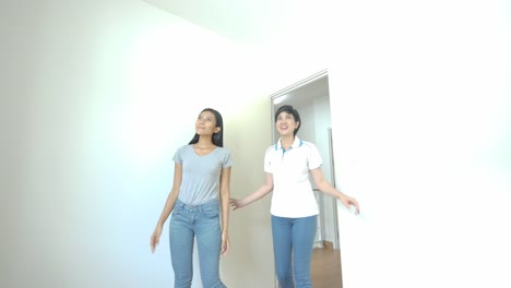 Happy-asian-women-LGBT-lesbian-couple-moves-into-a-new-apartment