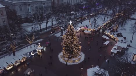 Lviv,-Ukraine---December-2018.-Arial-shot.-Lvov-Opera-house.-Christmas-tree.-Christmas-Fair.-People-are-walking-around-the-city-center.-Night-time