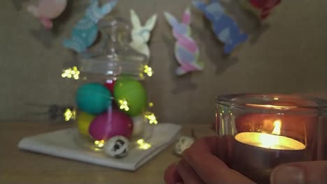 Easter-decoration-woman-hands-holding-candle