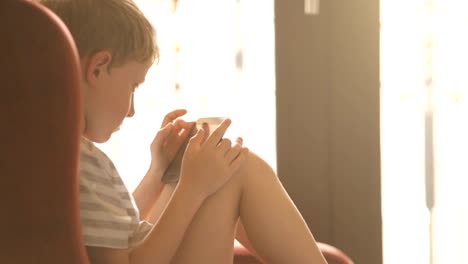 Boy-playing-on-PC-tablet