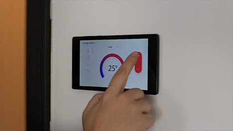 Smart-home-climate-control-device-on-a-wall