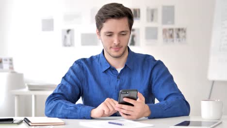 Casual-Adult-Man-Using-Smartphone,-Typing-Message