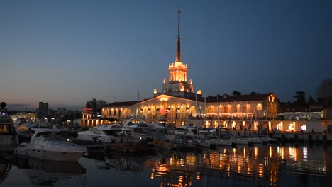 Marine-Station-at-seaport-and-the-Black-Sea-in-the-Night-in-Sochi,-Russia