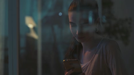 Young-woman-sitting-next-to-window-and-chatting