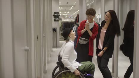 Woman-in-Wheelchair-Trying-on-Outfit-at-Clothing-Store