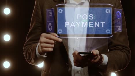 Businessman-shows-hologram-POS-Payment