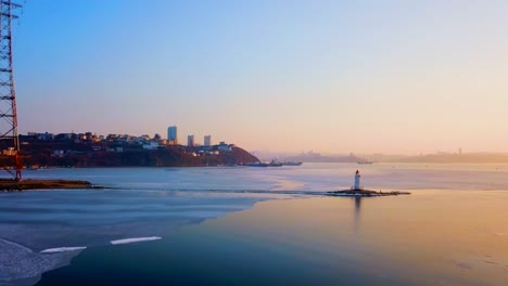 Aerial-winter-view-of-the-Tokarevskiy-lighthouse---one-of-the-oldest-lighthouses-in-the-Far-East,-still-an-important-navigational-structure-and-popular-attractions-of-Vladivostok-city,-Russia.