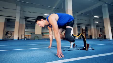 A-man-with-a-prosthetic-leg-start-running-in-the-gym