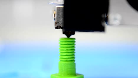 macro-3D-printer-is-the-model-of-the-screw-thread-on-the-green-blurry-background