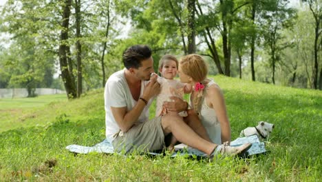 SLOW-MOTION:-Proud-daddy-and-mummy-watching-first-steps-of-their-baby-girl