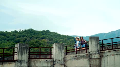 Two-friends-traveling-together,-they-were-in-a-stunningly-beautiful-location-in-the-mountains.