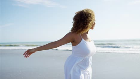 Afro-hair-African-American-female-paddling-in-waves