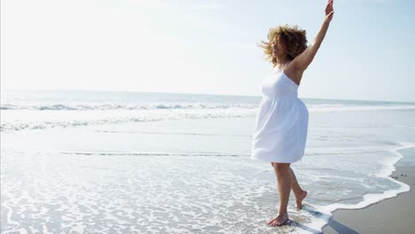 Plus-size-Ethnic-female-paddling-in-ocean-waves