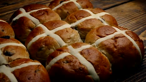 Passing-Hot-Cross-Buns-On-Wooden-Table