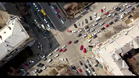 view-of-intersection-of-streets-in-Kiev-with-cars,-taxis,-bus-and-people-from-above-in-FullHD