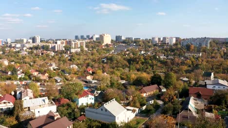 Autumn-aerial-view-of-cityscape-with-cloudy-blue-sky-from-the-drone.