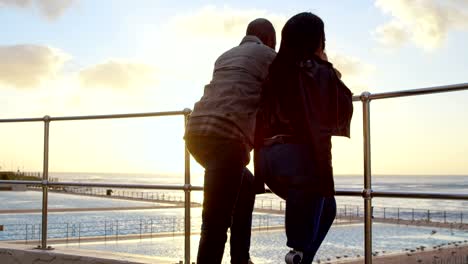 Couple-standing-near-railing-on-a-sunny-day-4k