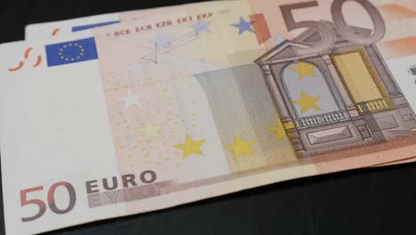 Money-counting-lot-of-different-Euro-banknotes-slow-mo-1080p-FullHD-footage---Slow-motion-European-Union-currency-falling-on-table-1920X1080-HD-video