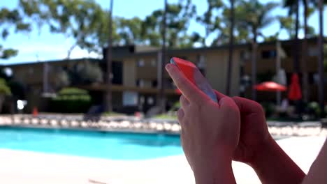 Woman-using-phone-on-the-vacations-in-slow-motion-120fps