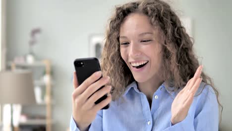 Wow,-Excited-Woman-in-Surprise-while-Using-Smartphone