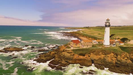 Light-House-Drone-Shot-Aerial-Helicopter-View-Ocean-Coast-Line-with-crashing-waves-sun-set-4K